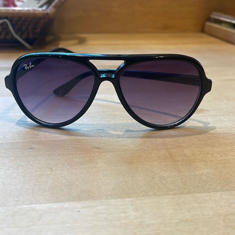 Worn purple sunglasses raybans